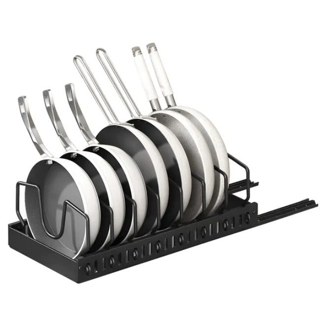 Set of black and white ceramic cookware in a black rack on a white background